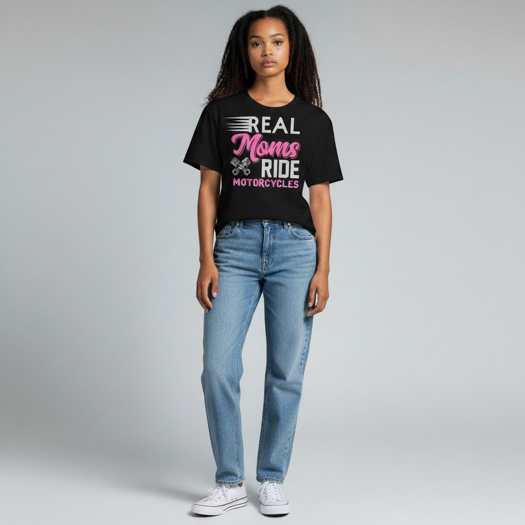 Purple Expressions black t-shirt with pink and white text that reads 'REAL Moms RIDE MOTORCYCLES' with motorcycle piston graphics.
